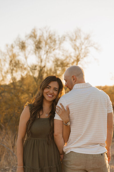 woman poses with husband for couples photo in mesa arizona 