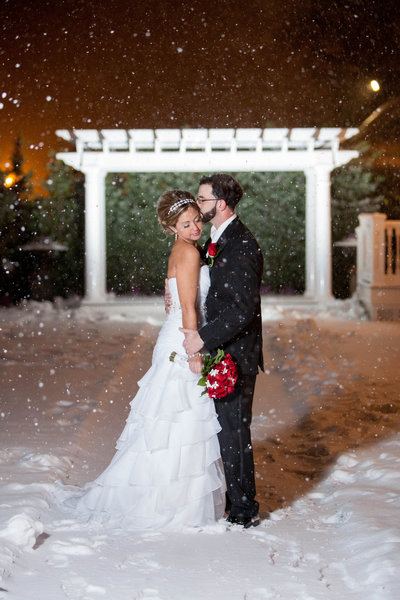 bride and groom in snow at clarks landing