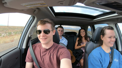 4 people drive to great sand dunes national park