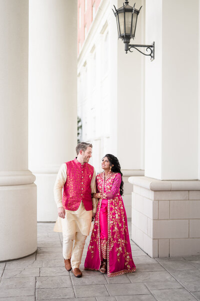 A bride and groom walk together during the Sandeep
