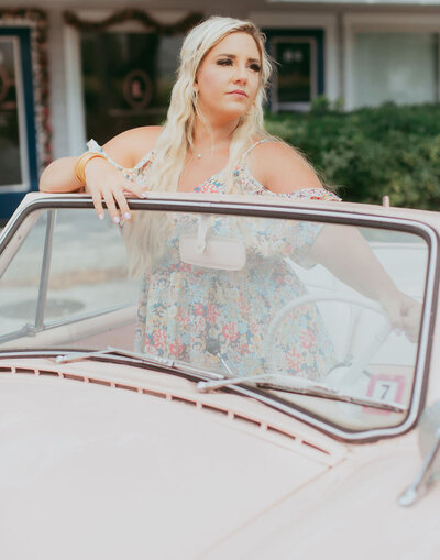 Iconic Lash founder and  Lash Artist Mentor Lea Love  poses near some water