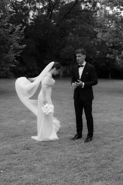 Luxury wedding in Europe – sophisticated bride in a modern wedding gown and groom in a timeless suit.