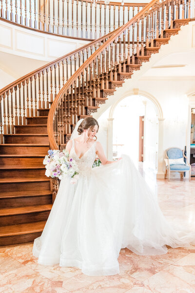 Atlanta Photographer Bridal Portraits | Bride twirling her dress in Bridal portraits at her Atlanta Wedding Venue