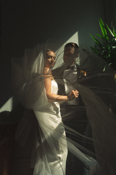Cinematic bridal portrait captured on film at one of Hawaii’s most iconic venues—Haiku Mill.