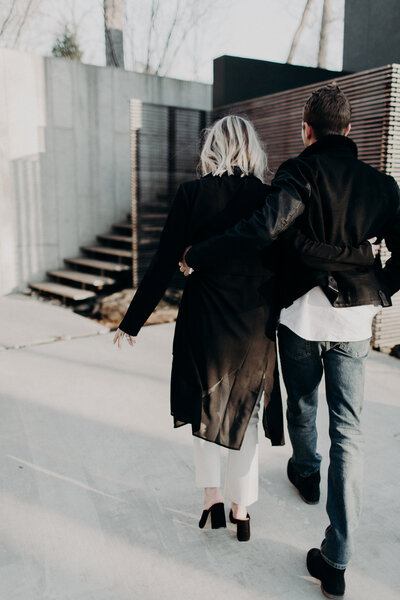 Catherine and Kevin holding hands while walking at airbnb in Charlottesville