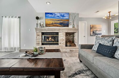 Living room with fireplace, Smart TV with streaming services in this 3-bedroom, 2.5 bathroom lake house with incredible view of Lake Belton located at Morgan's Point, near Rogers Park and Temple Lake Park.