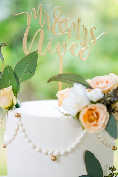 top tier wedding cake with peach roses