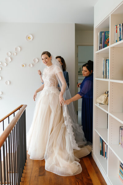 Bride getting ready for her Dallas wedding, wearing a gown by Vera Wang