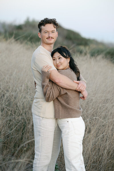 A couple walking along the ocean's edge