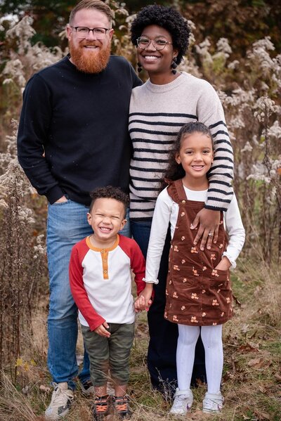 family at acadia reservation for photography session all standing together smiling