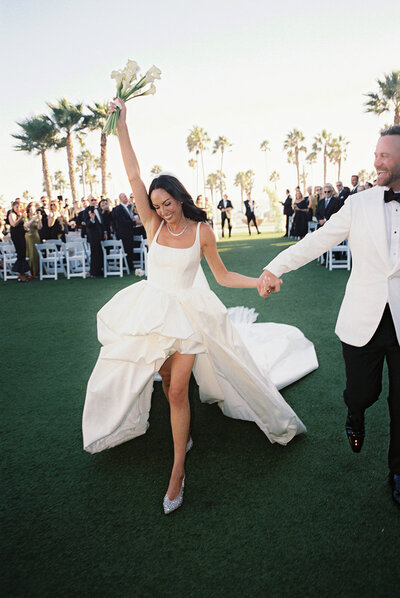 Bride and groom walk up memorial steps at their DC wedding
