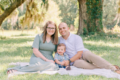 Family posing with one year old son for family pictures in Guyton, Ga