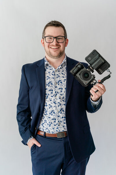Scott Woofter holding his wedding video camera