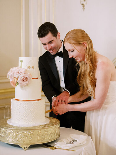 Classic wedding at the historic Cosmos Club in Washington DC featuring cake cutting moment, by editorial Washington DC wedding photographer specializing in timeless weddings