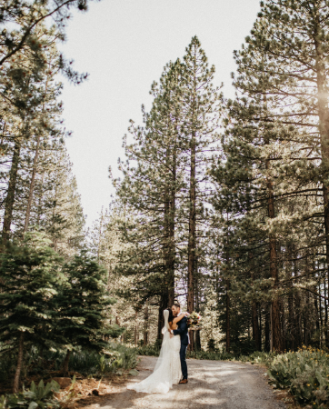 Tahoe Wedding Planners couple walking on path under pine trees at summer wedding venue Mitchell's Mountain Meadows Sierraville near Truckee, Joy of Life Events image by Lukas Koryn