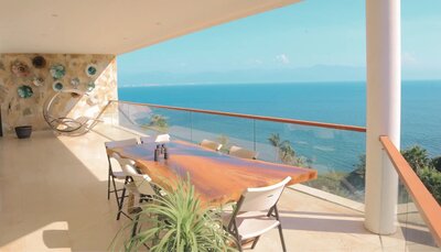 The balcony at Sayulita Wellness Retreat offers stunning ocean views, providing a serene space for relaxation, journaling, or quiet contemplation amidst nature.