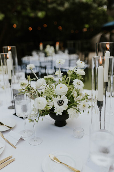 White and Green centerpiece in black vessel.