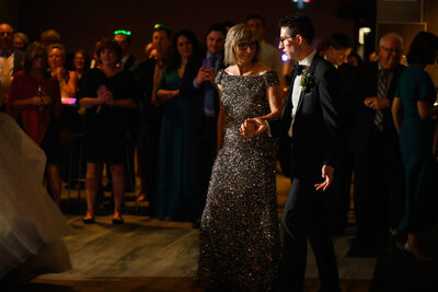 son leads mom to dance floor at Alpine Ski Club wedding