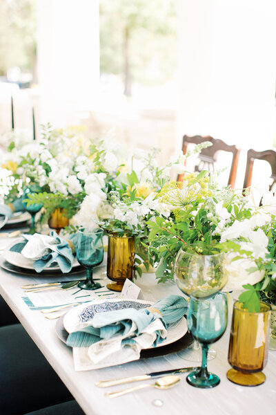 yellow and white floral display on table