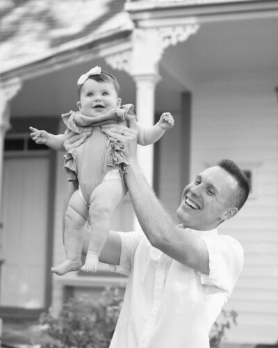 dad holding baby in a photo session