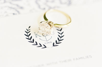 Nautical wedding crest and gold diamond ring