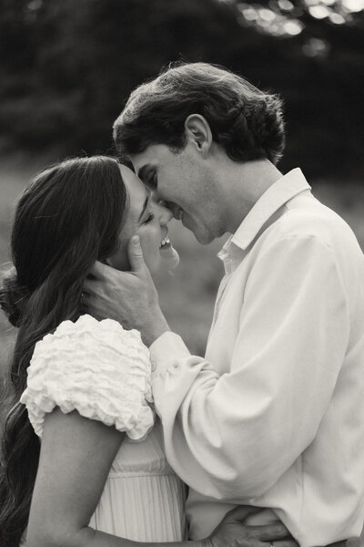 Black and white close-up of a couple sharing a tender moment in Nashville, TN—elevated, romantic storytelling from The Director’s Cut experience.