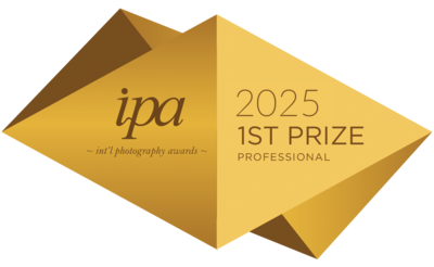 2025 Golden International photographer of the year contest winner badge that is given to first prize winners.