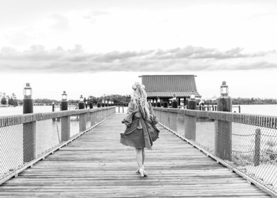 Black and white photo of  influencer walking at Disney's Polynesian resort