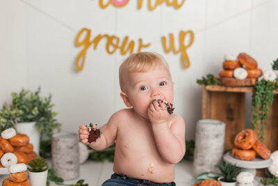 baby boy in white potato sack pose in kelowna studio