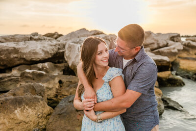 Couples takes photos at St. Pete Beach on the gulf coast of Florida