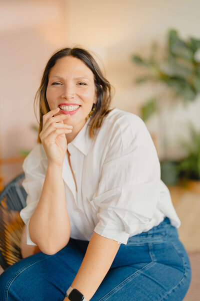 Emily Marson portrait in a white shirt and smiling