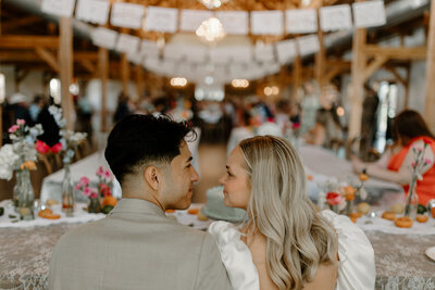 bride and groom kissing outside