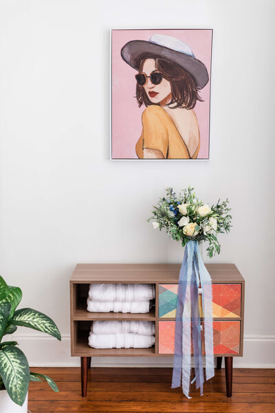 Romantic elopement bouquet  on a table in the bridal getting ready space in a Savannah Airbnb