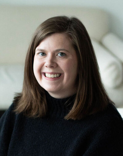 Testimonial image of a woman celebrating deep personal transformation and emotional freedom after immersive coaching