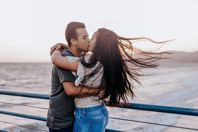 Nashville couples photographer captures beach portraits while couple hugs