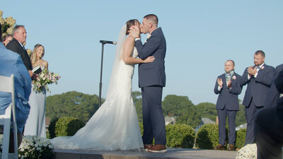 A couple kissing at the altar during their Lehigh Valley wedding ceremony.