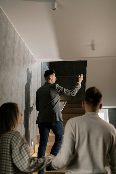 Real estate agent showing clients a property