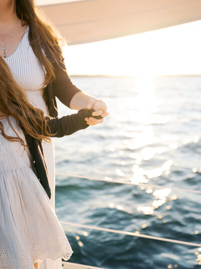 Mom holding toddler daughters hand in Virginia Beach family photography session