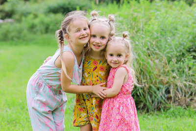 Three girls holding each other | Family Photography Session