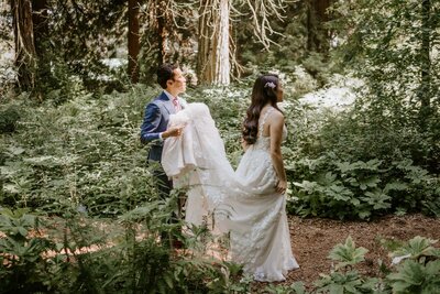 bride and groom walk the redwoods