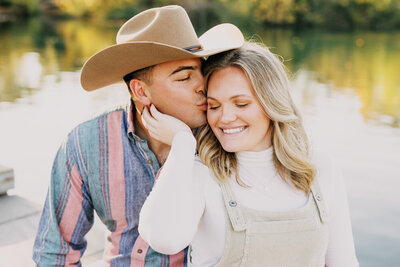 Engaged couple enjoying a romantic moment at Centennial Park in Nashville, TN