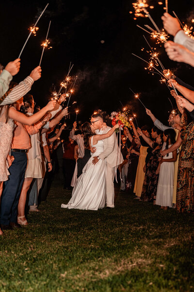 Bride and Groom sharing a kiss at sunset on the beach- townsville wedding photography by Jamie Simmons - Simmons Memorable Moments