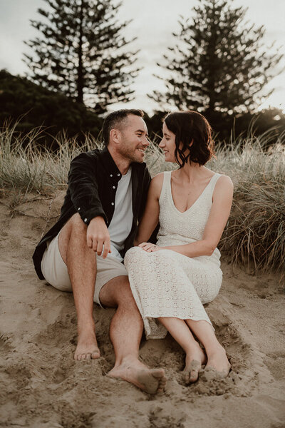Engagement photography in Auckland at Riverhead Forest with a happy couple in love