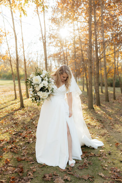 A bride looking at her shoes.