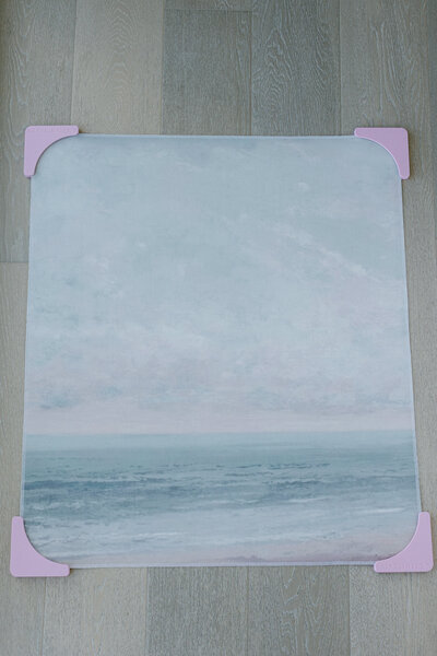 Beach linen styling mat with subtle blue tones, perfect for coastal weddings