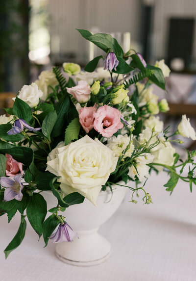 Up close image of a floral arrangement with pink, purple, and white flowers
