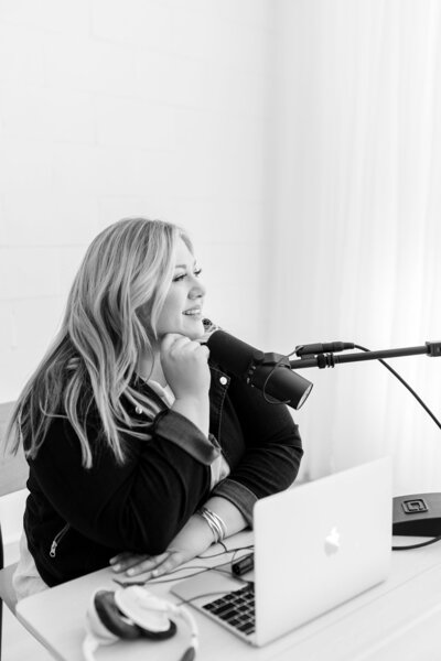 amanda in front of microphone and computer