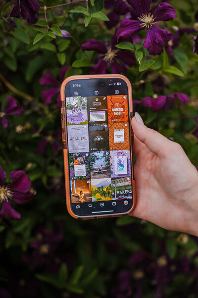 Brightspot CMS lifestyle branding image featuring Emma using smartphone outdoors on wooden stool with rustic backdrop