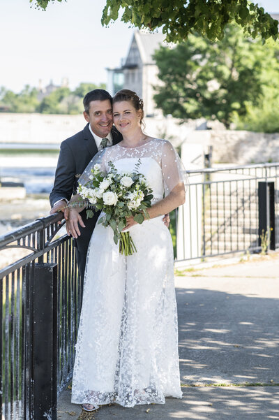 Jen wore a custom made mikado jumpsuit with a 3D floral lace a-line dress overlay at her Cambridge Mill wedding.