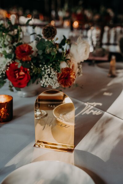 Gold table number set on wedding table